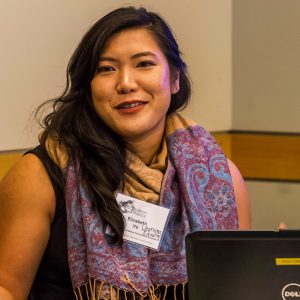 Woman at an event smiles