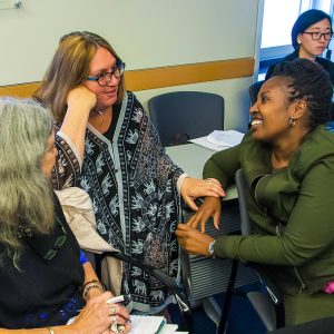 Three women having a conversation