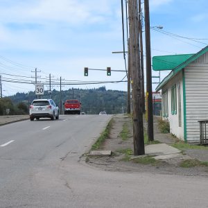 Rural road through a town with no sidewalks