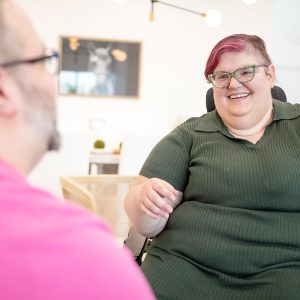 Person in a wheelchair talks to someone out of frame