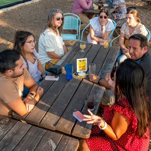 People sitting around picnic table